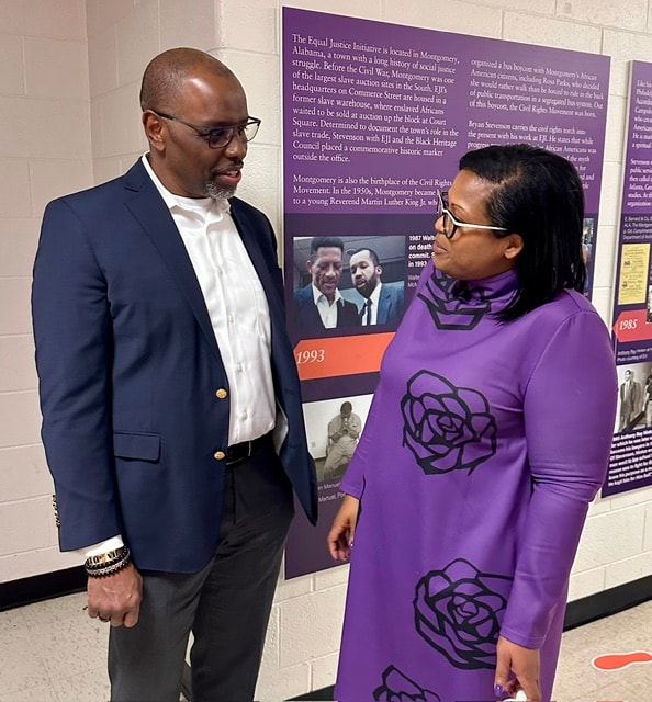 Dr. Barnes in conversation at an Equal Justice Initiative exhibit